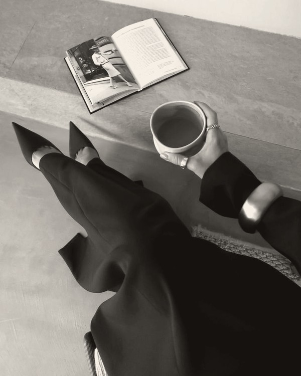 Coffee and a book on a stone surface